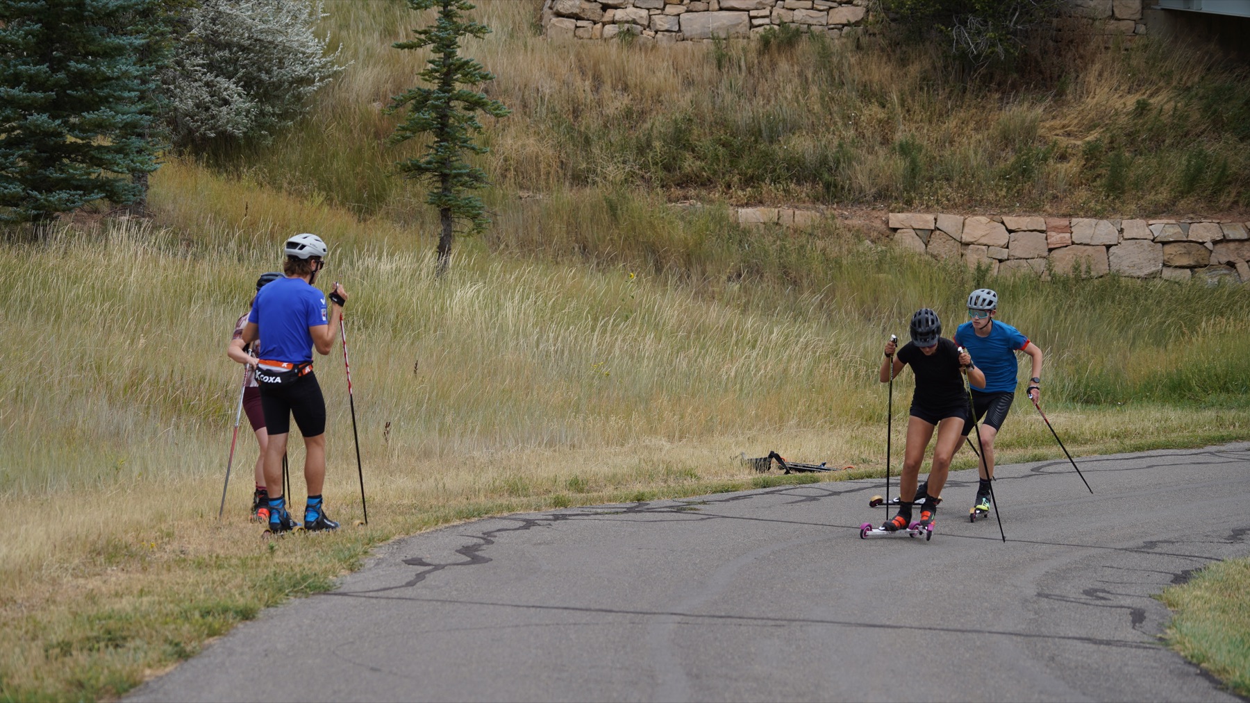 Camp athletes working through a rollerski session